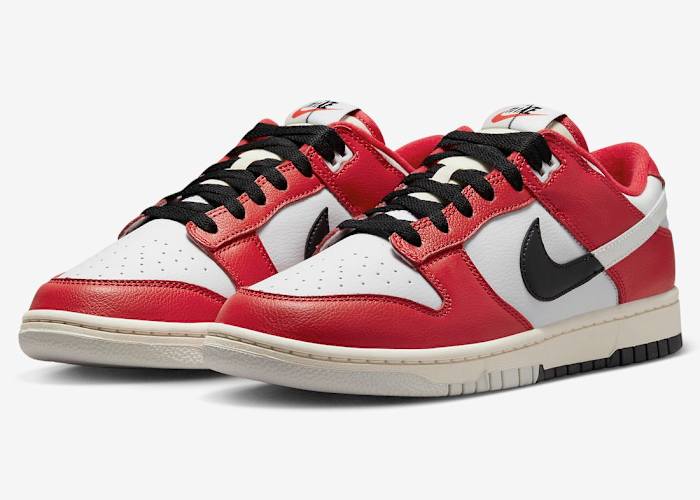 Side view of red, white, and black Nike Dunk sneakers.